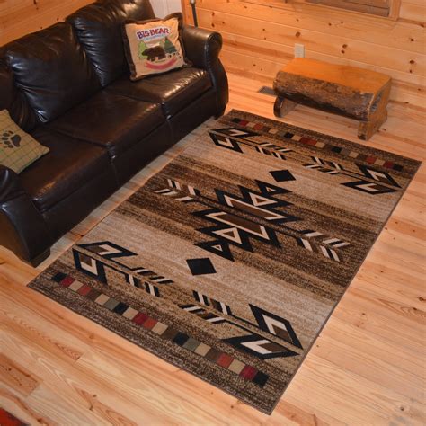 Mayberry rugs - The American Destination Cypress Creek 7'10"x9'10" area rug is from the American Destination collection. This rustic nature design with a campsite theme will add a touch of charm to any space. It features a durable polypropylene yarn that is fade and stain resistant. Multiple sizes are available to accommodate many areas of your home or cabin.